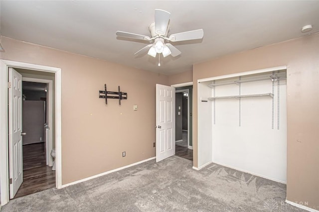 unfurnished bedroom with a closet, ceiling fan, and carpet flooring