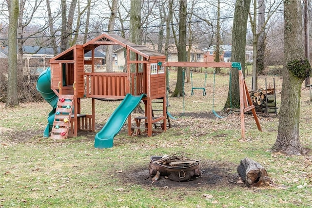 view of jungle gym with an outdoor fire pit