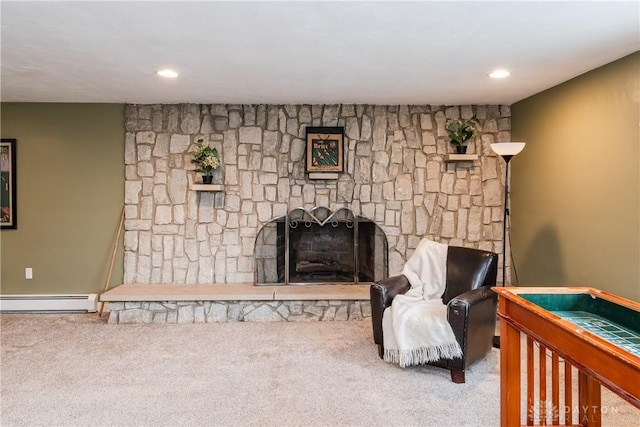 living area with a stone fireplace, baseboard heating, carpet flooring, and recessed lighting