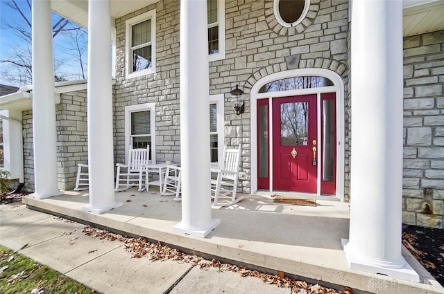 entrance to property featuring a porch