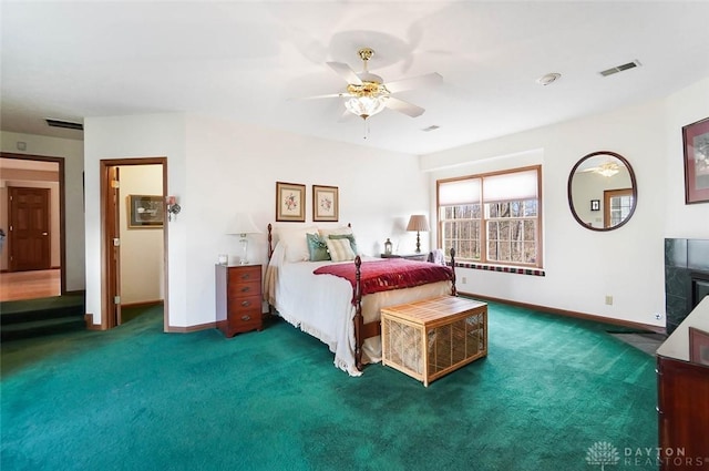 bedroom featuring ceiling fan and dark carpet