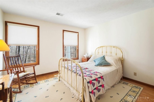 bedroom with hardwood / wood-style floors