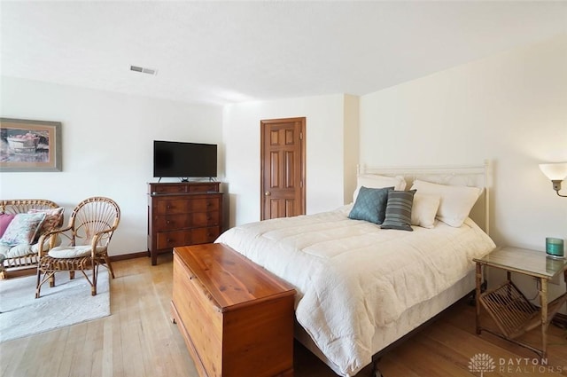 bedroom with light hardwood / wood-style floors