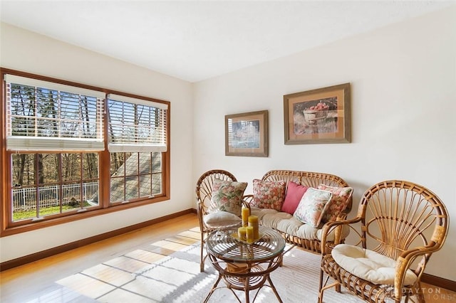 sitting room featuring light hardwood / wood-style flooring