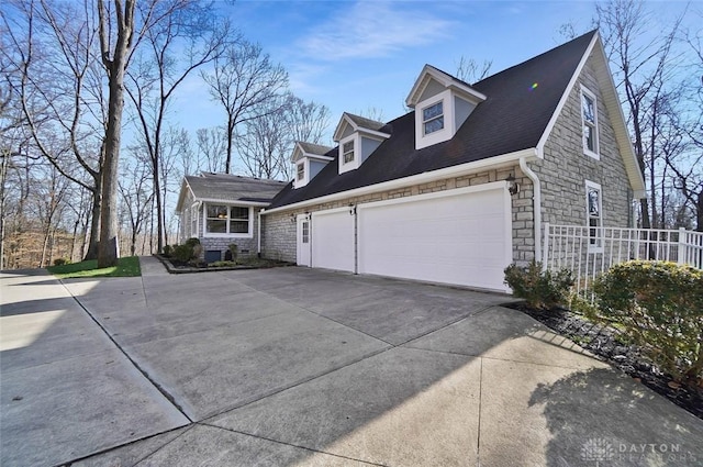 view of side of property featuring a garage