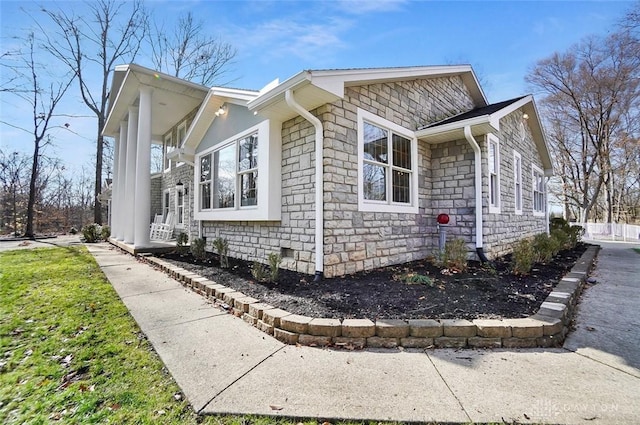 view of side of property featuring a porch