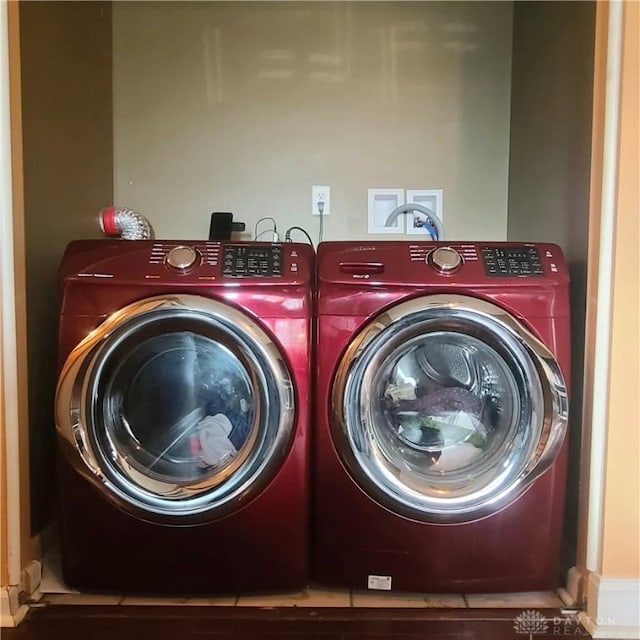 washroom with independent washer and dryer