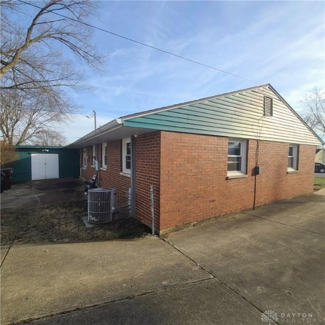 view of side of property with central AC