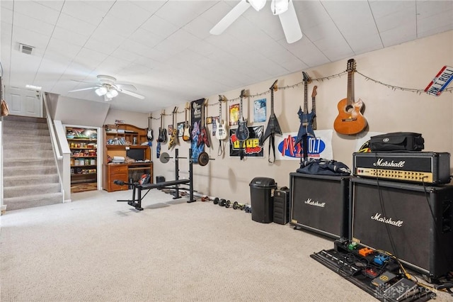 workout area featuring carpet and ceiling fan