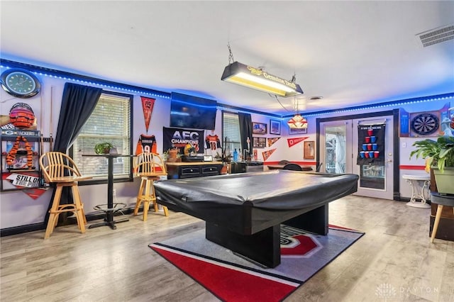 playroom with pool table, light hardwood / wood-style floors, and french doors