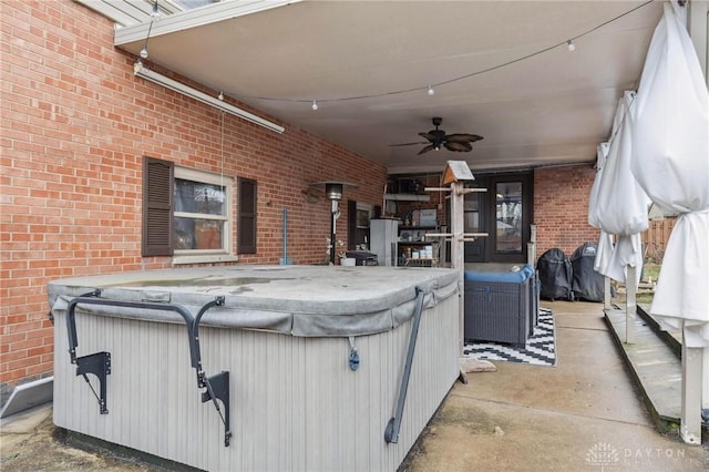 view of patio / terrace featuring an indoor hot tub and ceiling fan