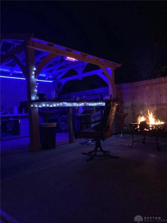 patio at twilight with an outdoor fire pit