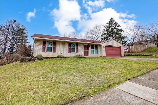 single story home with a garage and a front lawn