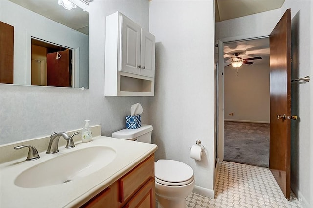 bathroom with vanity, ceiling fan, and toilet