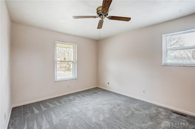 carpeted empty room with ceiling fan