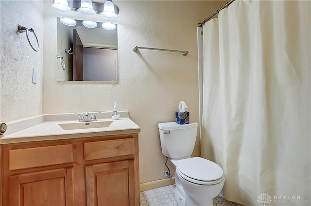 bathroom featuring vanity, a shower with curtain, and toilet