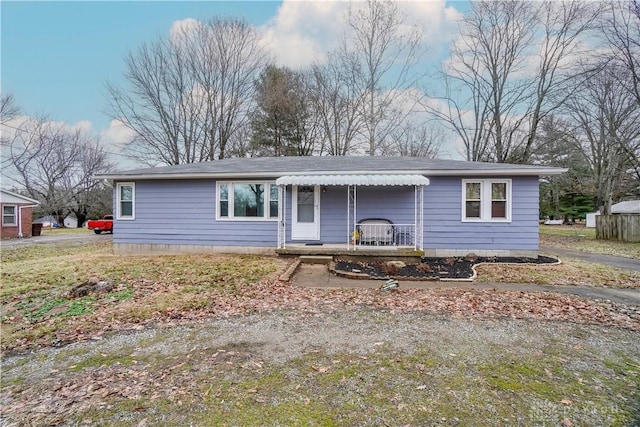 ranch-style house featuring a porch