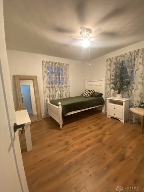 330 W Spring St, Eaton, OH 45320 - bedroom with wood finished floors and a ceiling fan