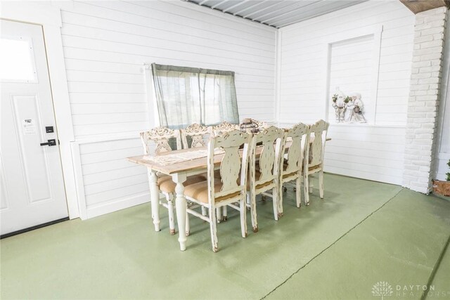 330 W Spring St, Eaton, OH 45320 - dining space featuring finished concrete flooring and wood walls
