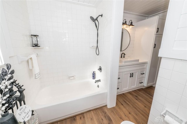 330 W Spring St, Eaton, OH 45320 - bathroom with wood finished floors, vanity, and bathtub / shower combination