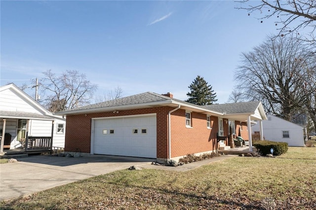 330 W Spring St, Eaton, OH 45320 - view of property exterior with covered porch, brick siding, concrete driveway, an attached garage, and a yard