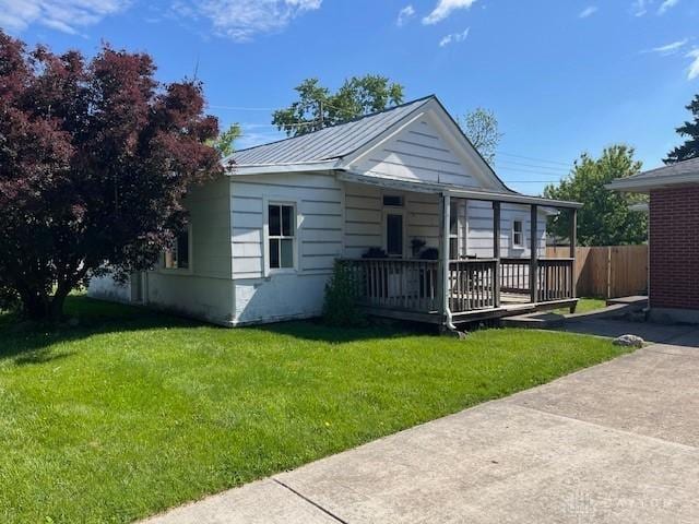 330 W Spring St, Eaton, OH 45320 - rear view of house with metal roof and a wooden deck