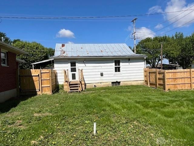 330 W Spring St, Eaton, OH 45320 - rear view of property featuring entry steps, metal roof, and a standing seam roof