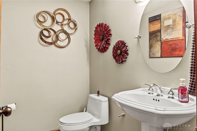 bathroom with sink and toilet