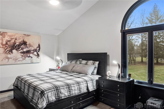 bedroom with lofted ceiling and ceiling fan