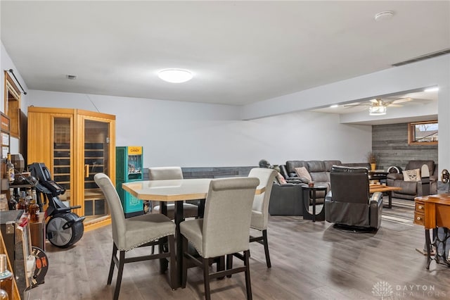 dining space featuring hardwood / wood-style flooring and ceiling fan