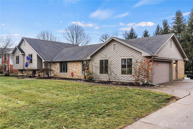 view of front of home featuring a garage and a front yard