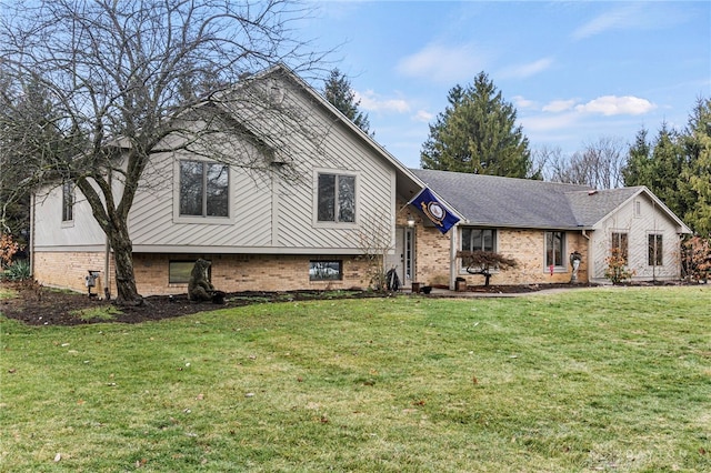 tri-level home with a front lawn