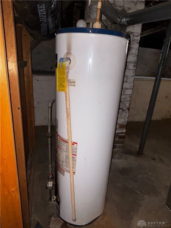 utility room with gas water heater