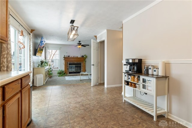 tiled living room with ceiling fan, radiator heating unit, and a fireplace