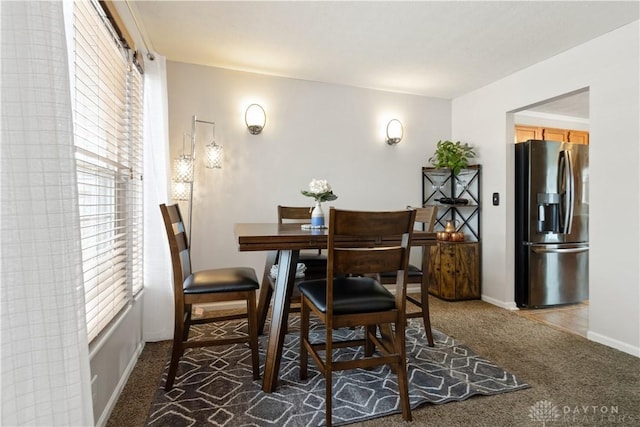 dining area featuring carpet floors