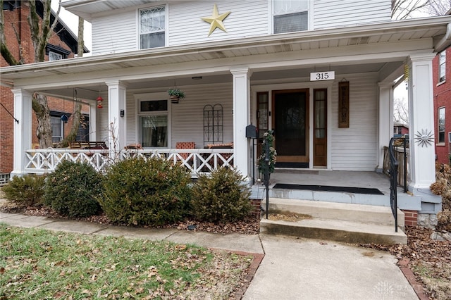 property entrance featuring a porch