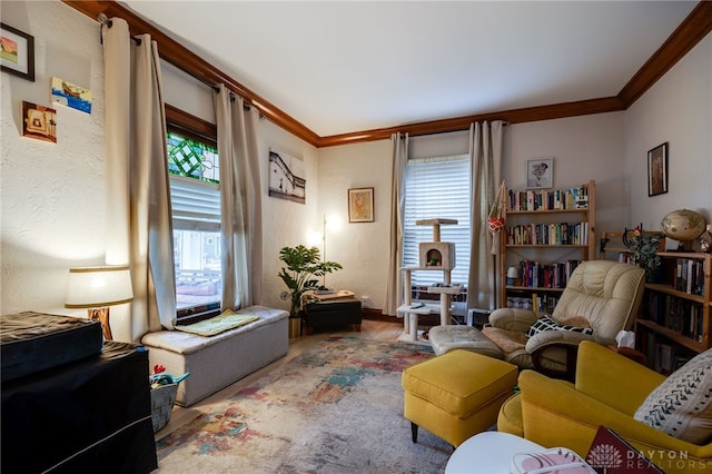 living room with crown molding, wood-type flooring, and a wealth of natural light