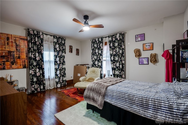 bedroom featuring dark wood-type flooring and ceiling fan