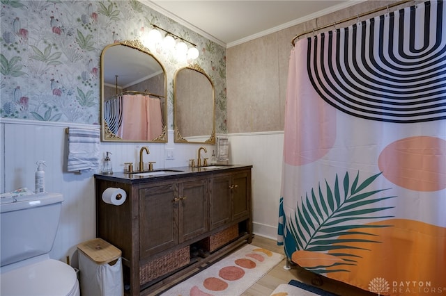 bathroom featuring vanity, crown molding, toilet, and hardwood / wood-style flooring