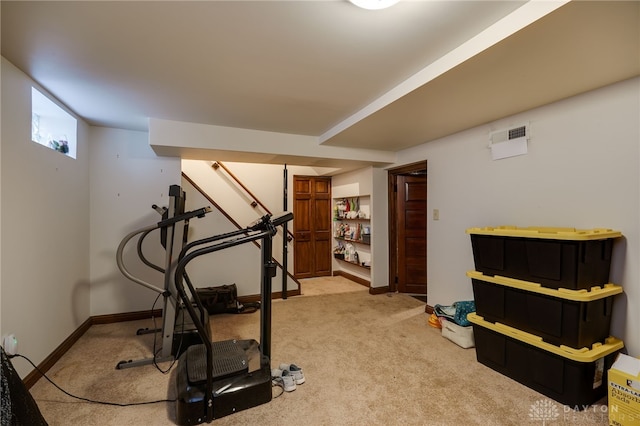 exercise room featuring carpet flooring