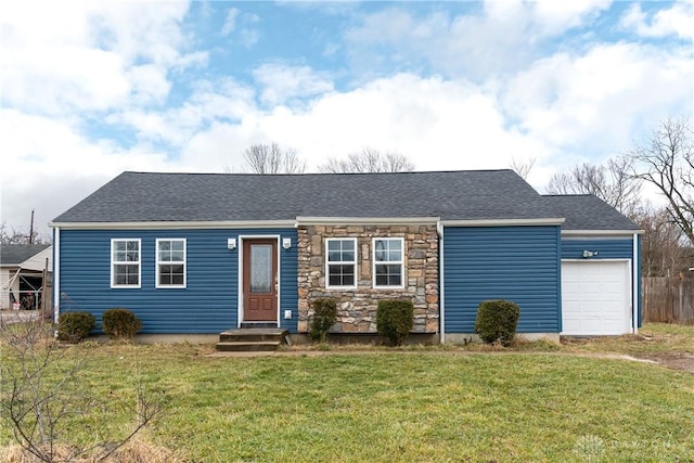 single story home featuring a garage and a front lawn