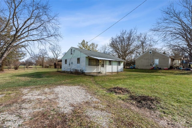 view of side of property featuring a yard