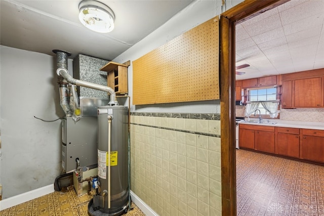 utilities featuring a sink and gas water heater