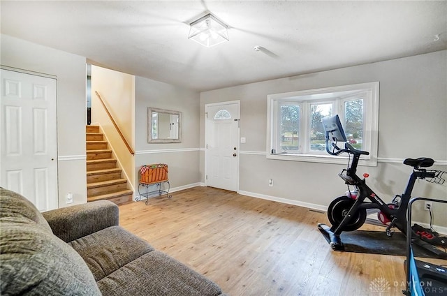 exercise area featuring hardwood / wood-style flooring