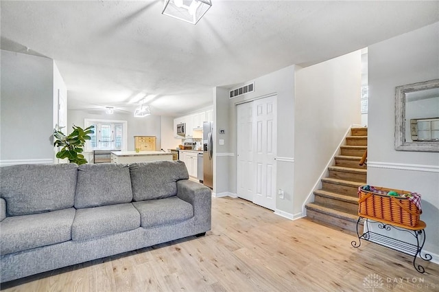 living room with light hardwood / wood-style floors