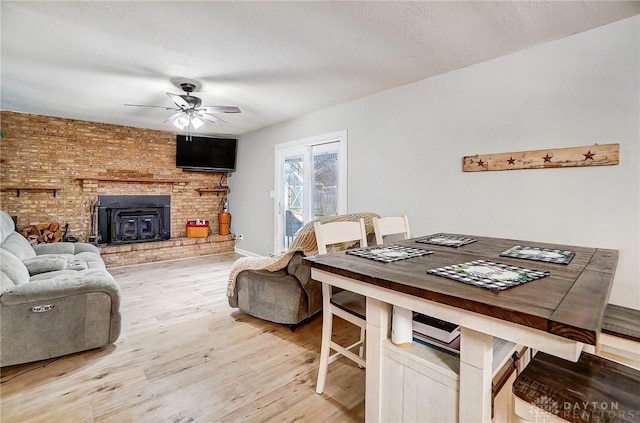 dining space featuring hardwood / wood-style flooring and ceiling fan