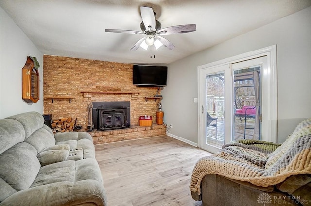 living room featuring ceiling fan and wood-type flooring