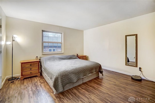 bedroom with hardwood / wood-style floors