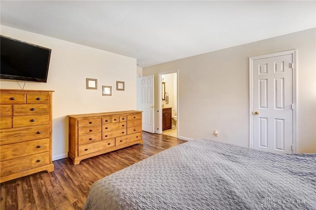 bedroom with dark hardwood / wood-style flooring