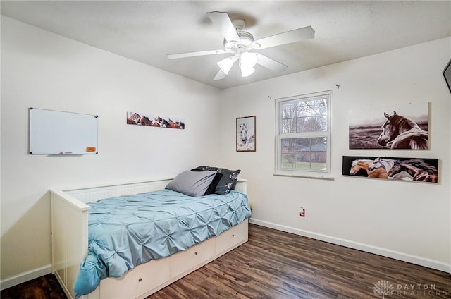 bedroom featuring dark hardwood / wood-style flooring and ceiling fan